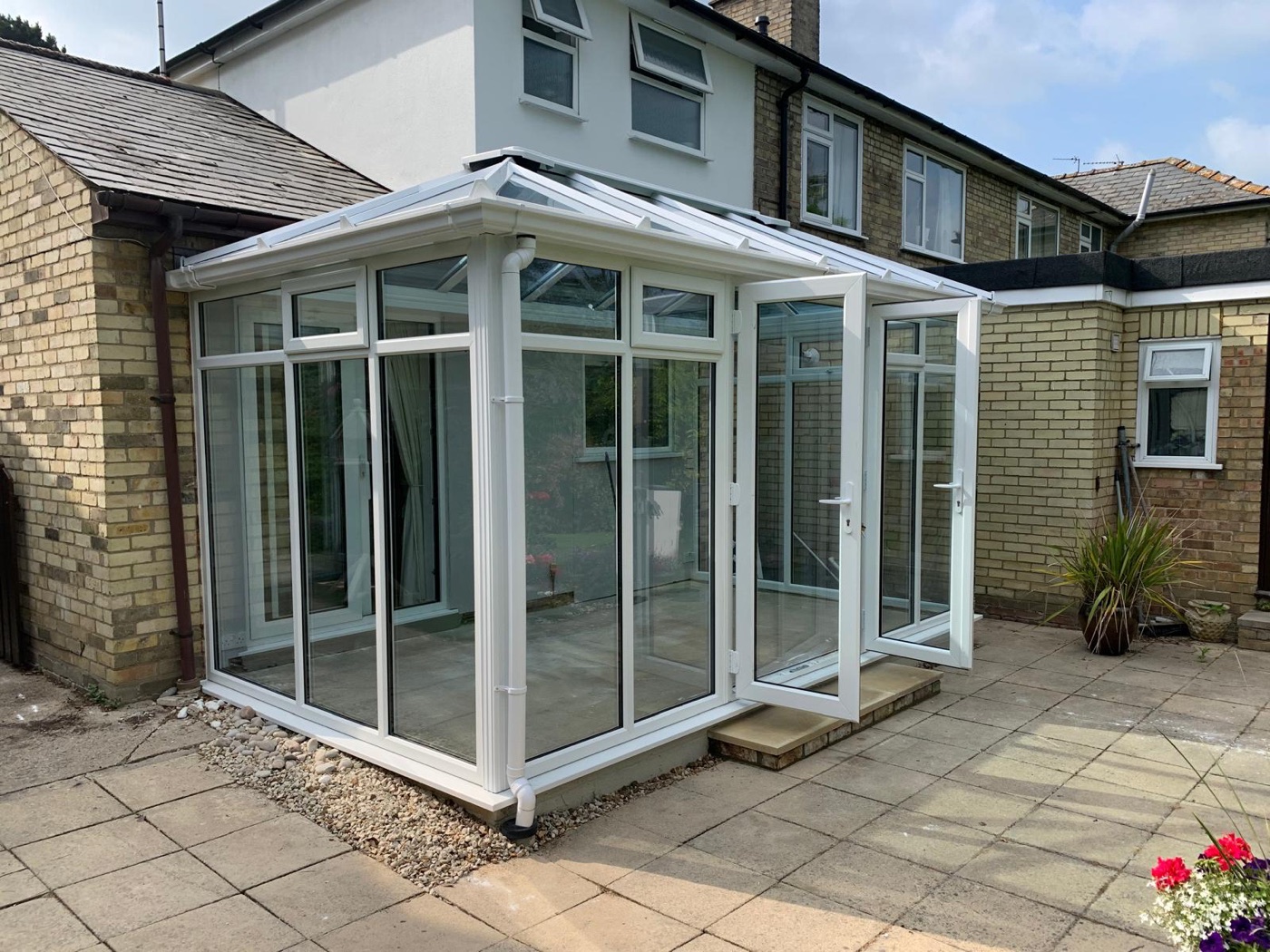 White glazed conservatory with open French doors in Cambridge
