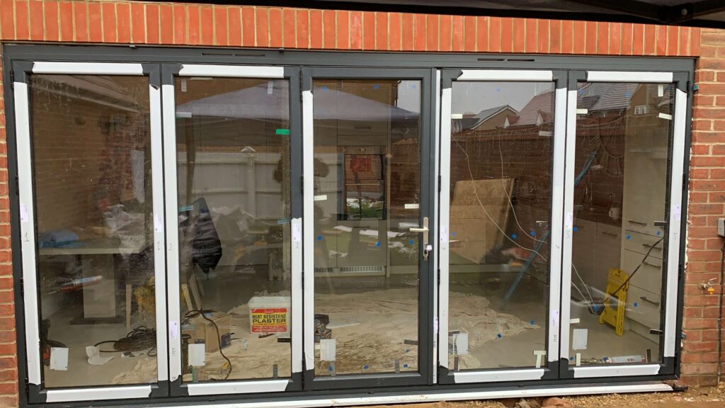 Aluminium bi-fold doors fitted in a new brick opening