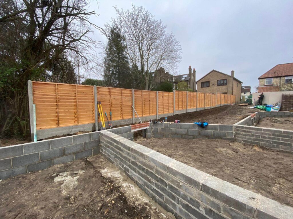 New timber fencing and blockwork foundations in a rear garden