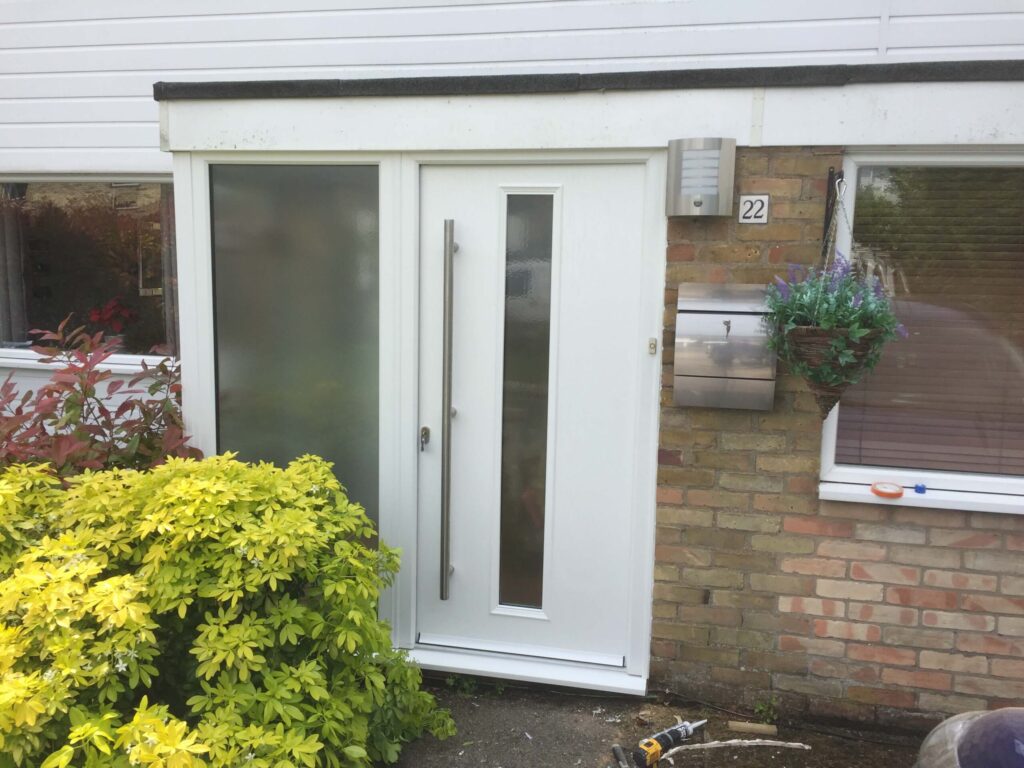 White composite front door with a frosted glazed side panel