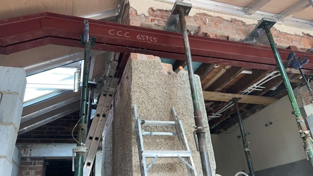 Steel beam installed with props during structural alterations