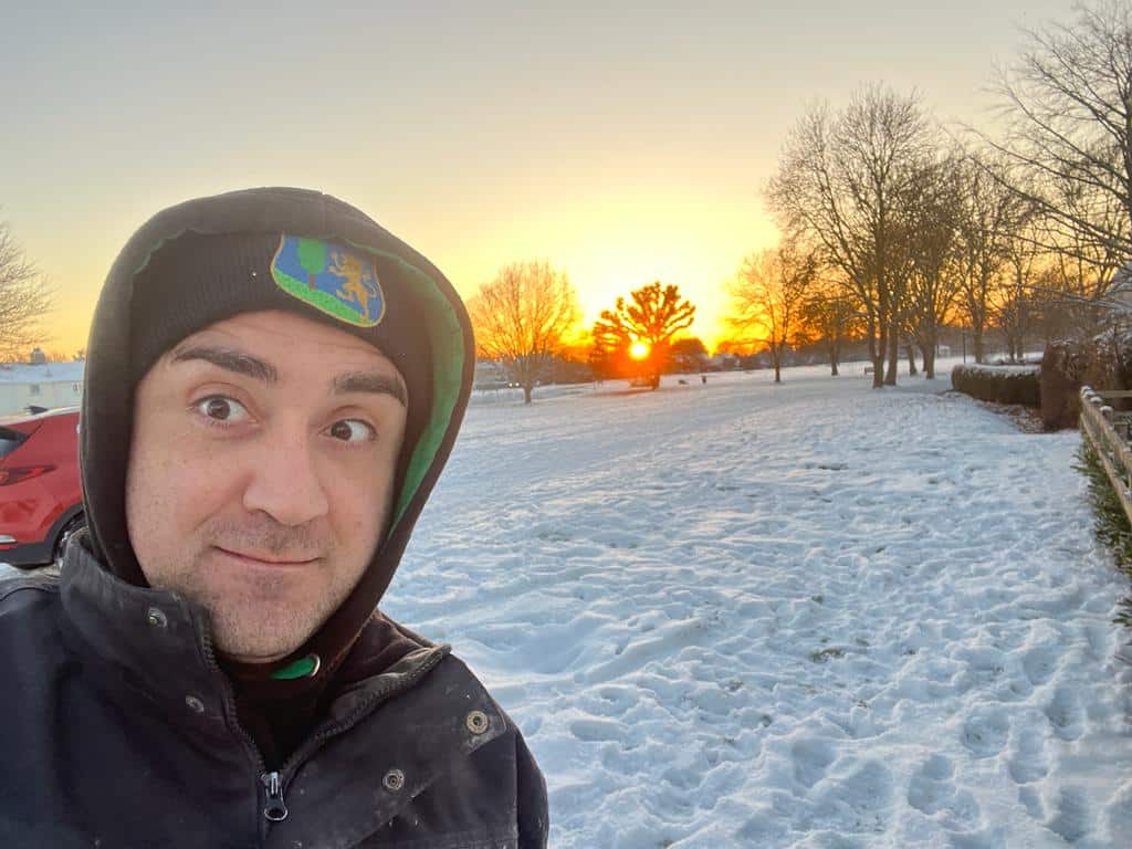 Ciampa & Sons team member outdoors on a snowy winter evening