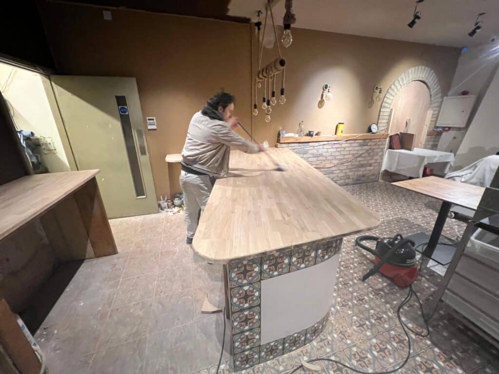 Kitchen worktop being fitted during a renovation