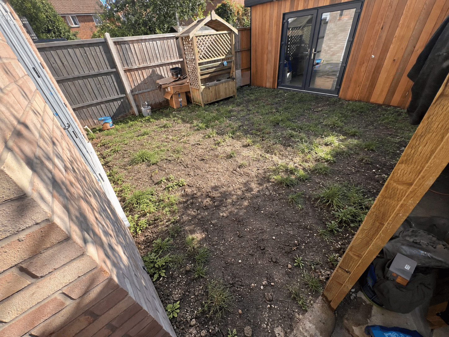 Illustrative reconstruction of the garden before the porcelain patio was installed
