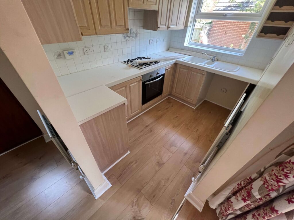 Renovated kitchen with wood-effect flooring