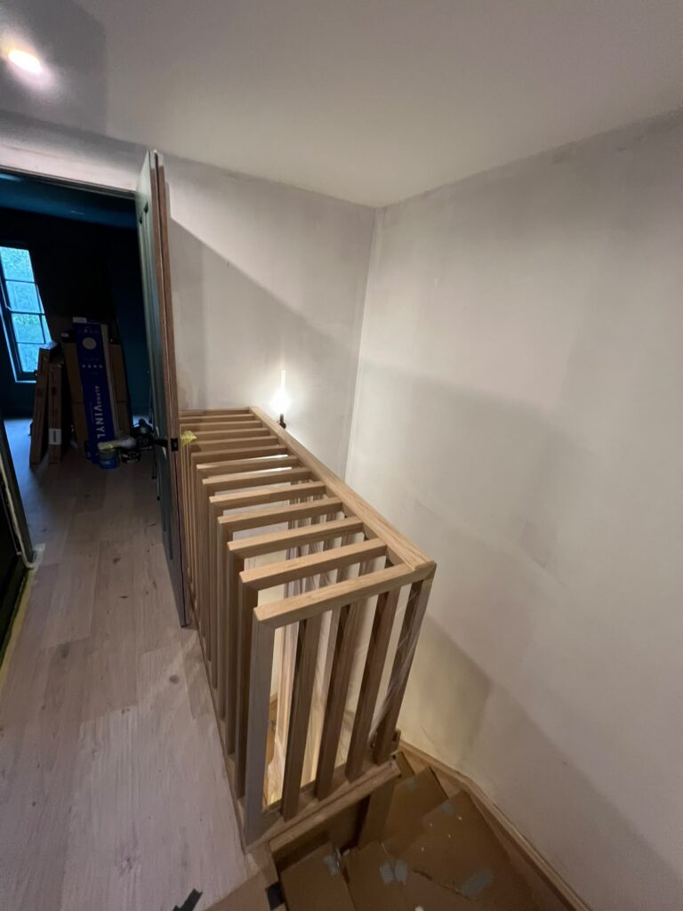 Slatted oak balustrade at the top of a staircase