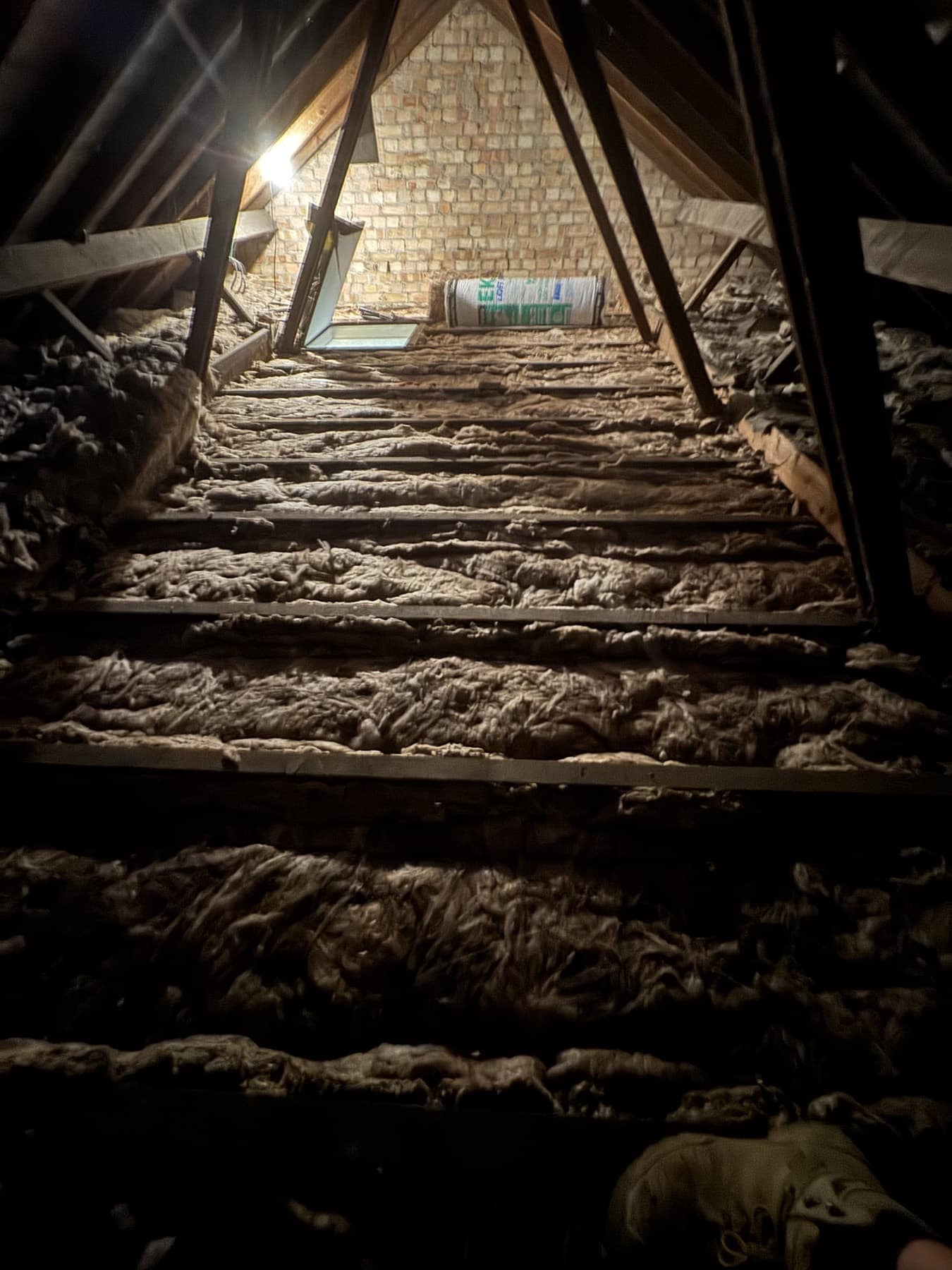 Open loft joists and insulation before the boarding work