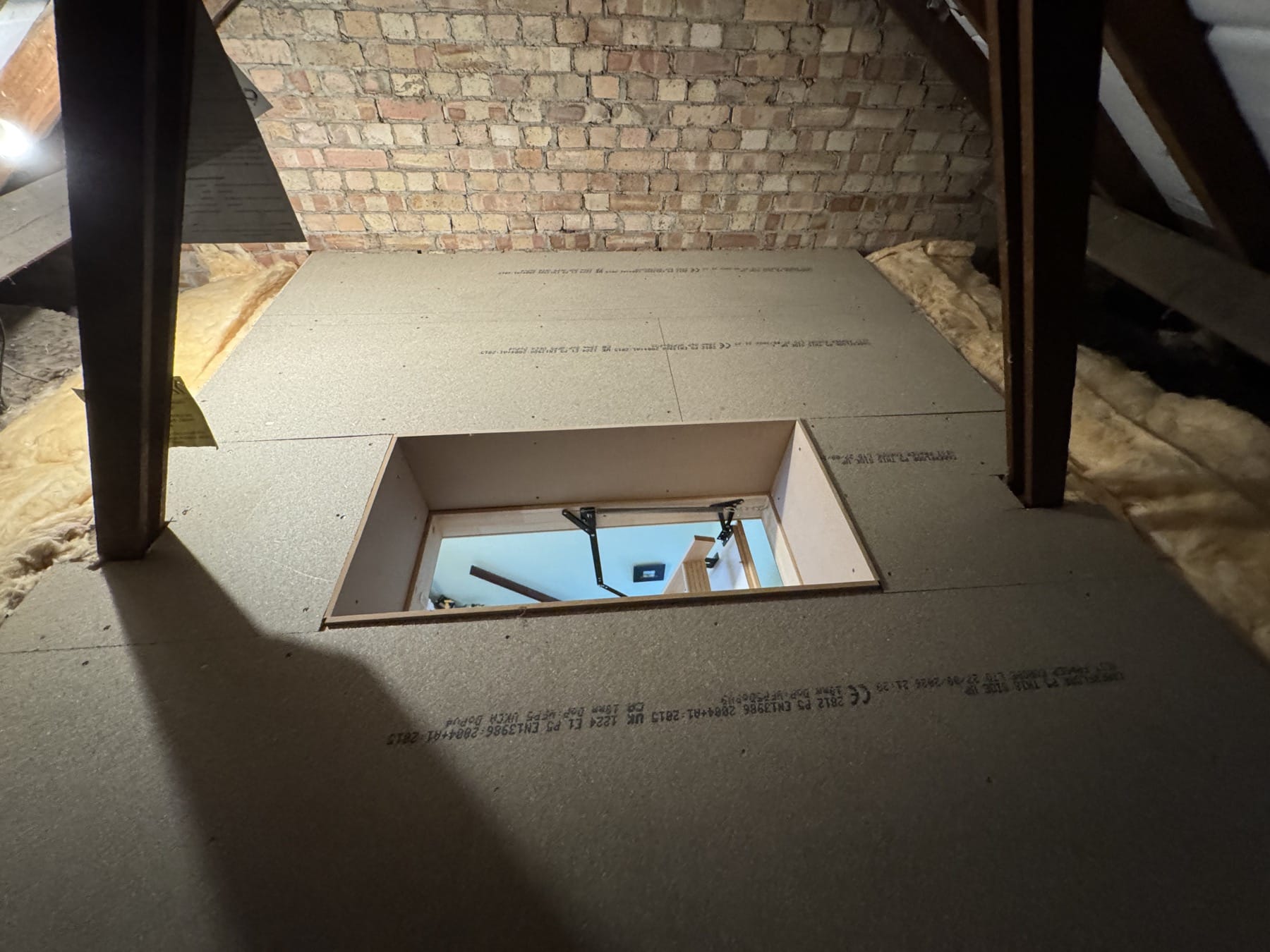 Completed loft boarding around the framed access hatch